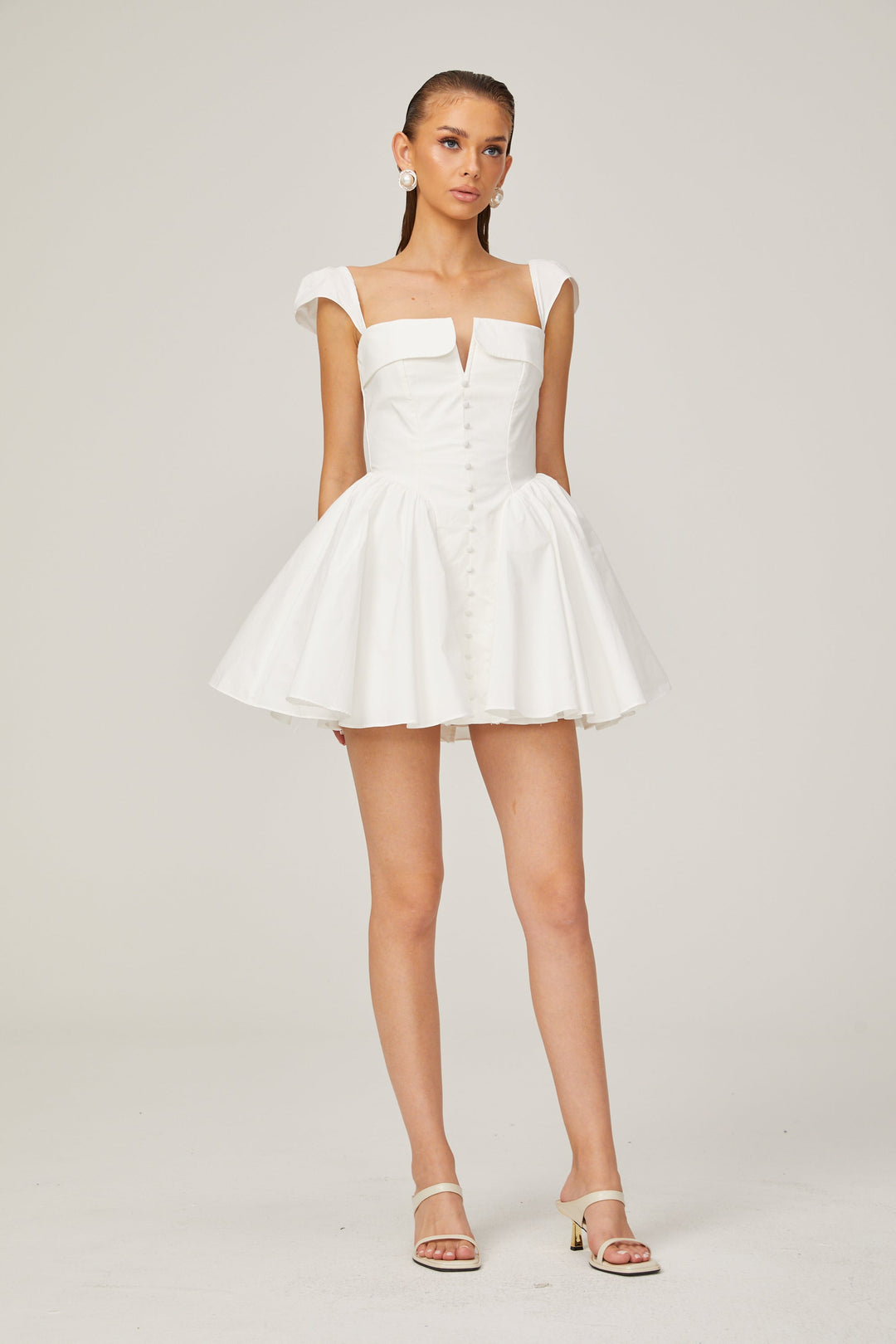 Julie white folded-neck bonded sleeveless mini dress - Celestia Couture