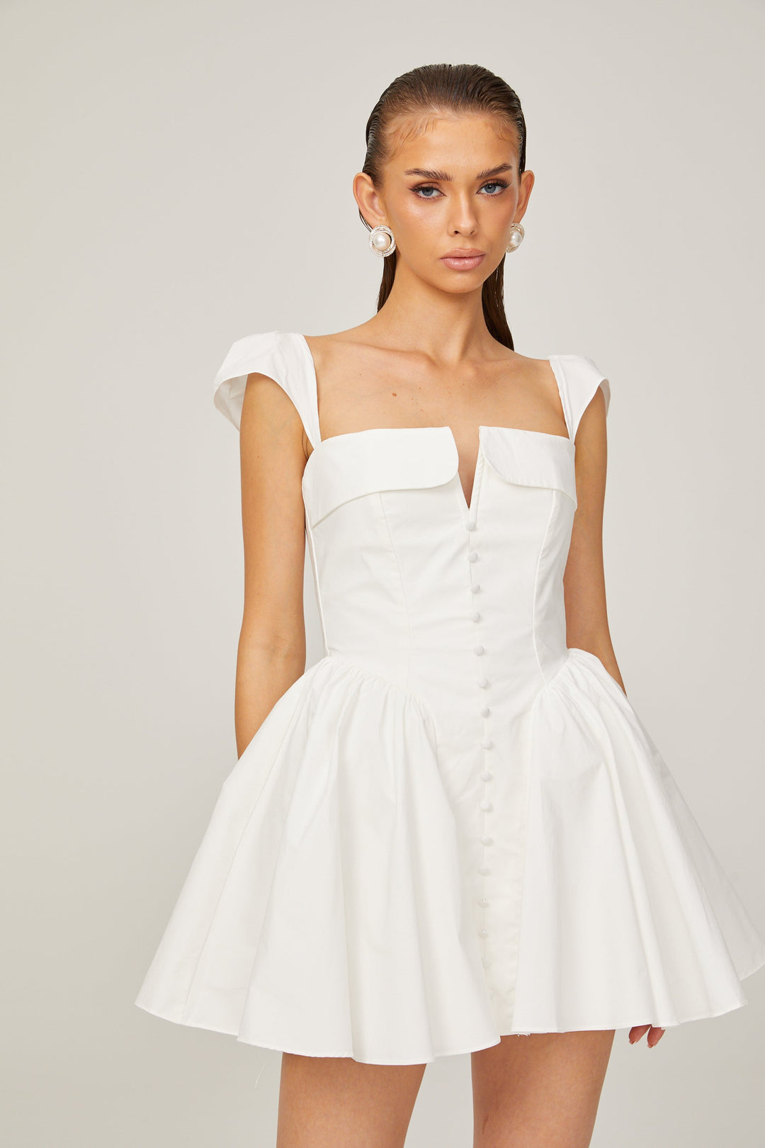 Julie white folded-neck bonded sleeveless mini dress - Celestia Couture