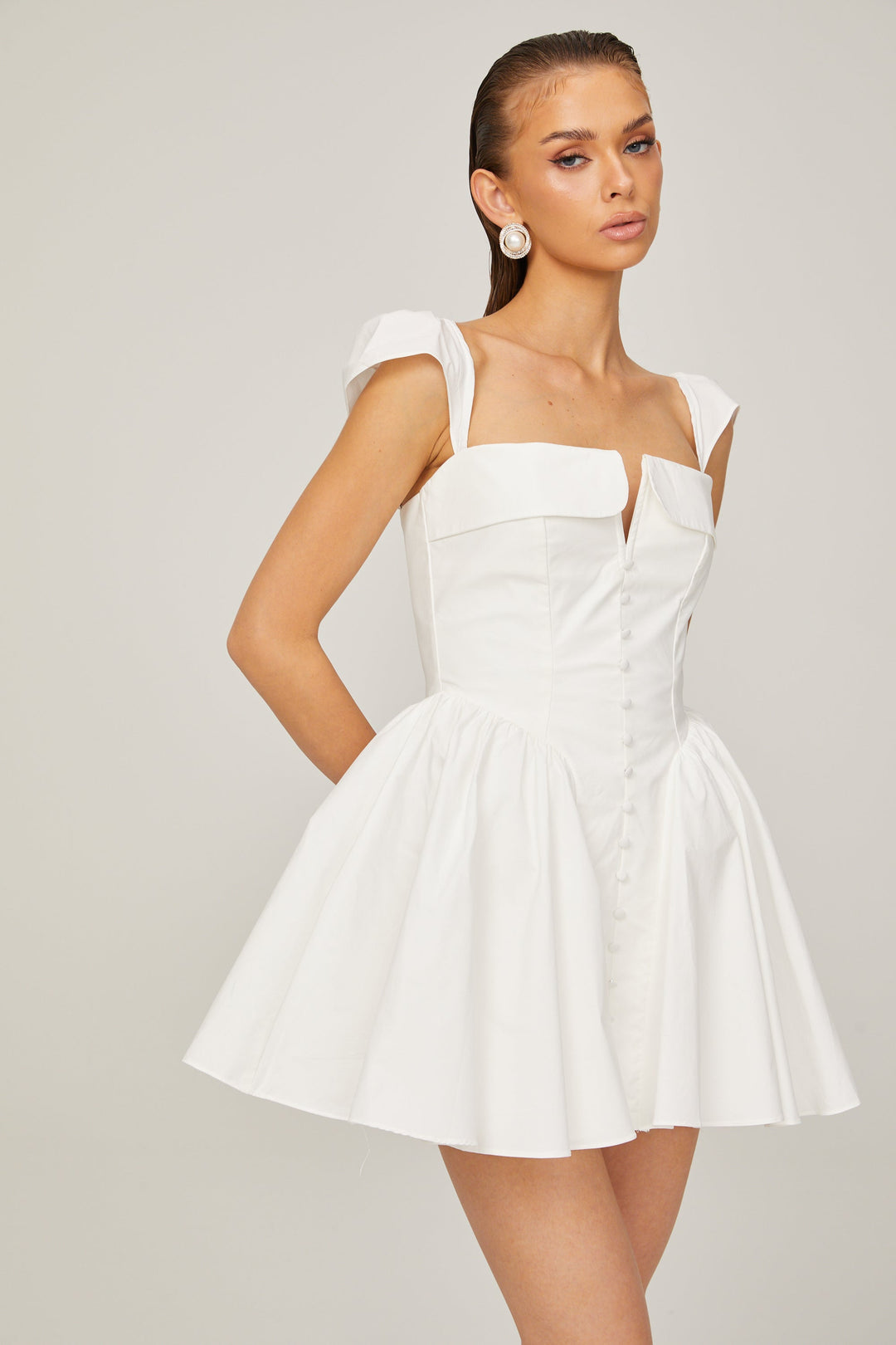Julie white folded-neck bonded sleeveless mini dress - Celestia Couture