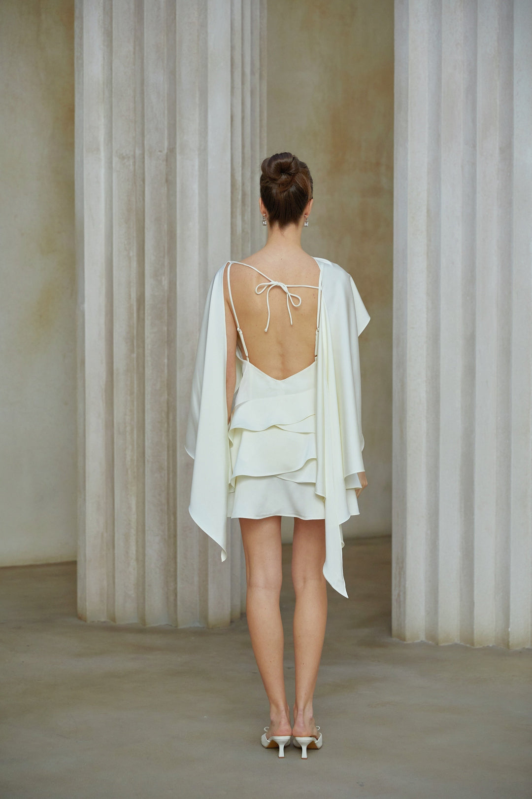 Lyna White Satin Ruffled Mini Dress with Shawl Panel Detail - Celestia Couture