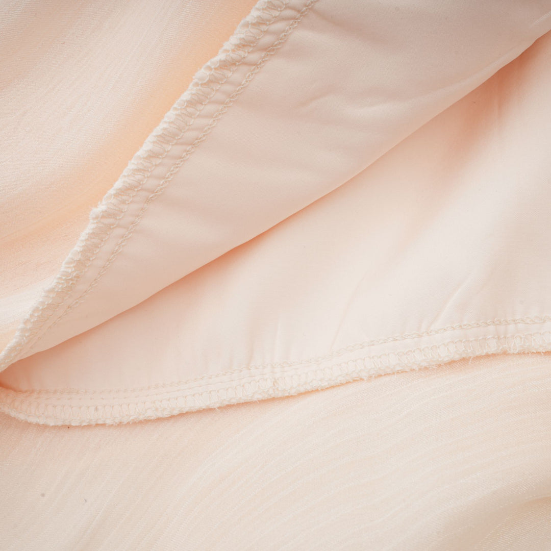Eugénie fully-pleated ruffled mini dress in Neutrals - Celestia Couture