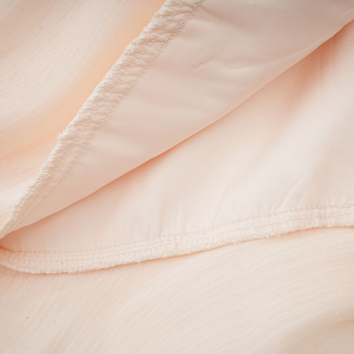 Eugénie fully-pleated ruffled mini dress in Neutrals - Celestia Couture
